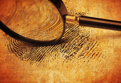 A magnifying glass over a fingerprint