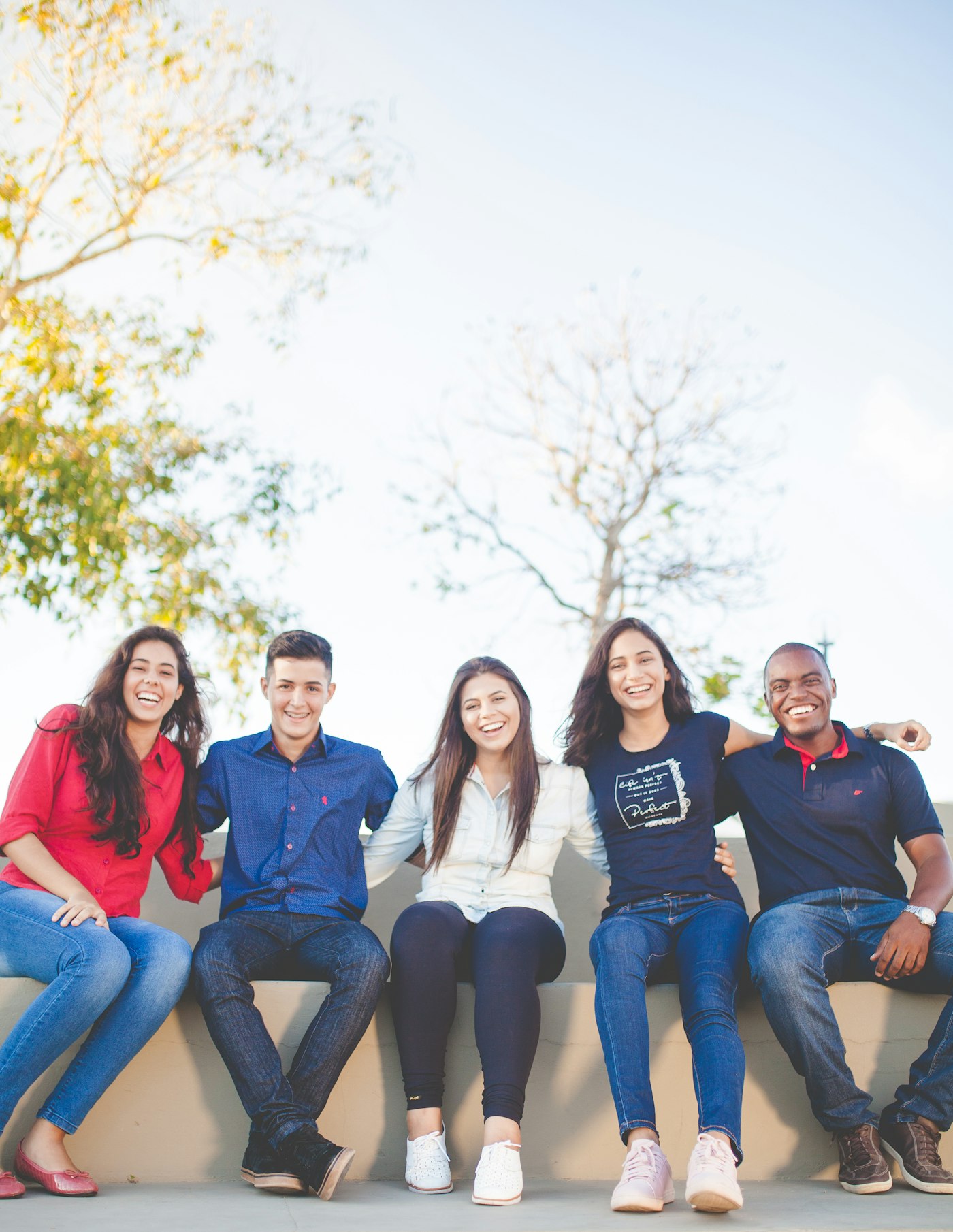 Young people sitting together outdoors